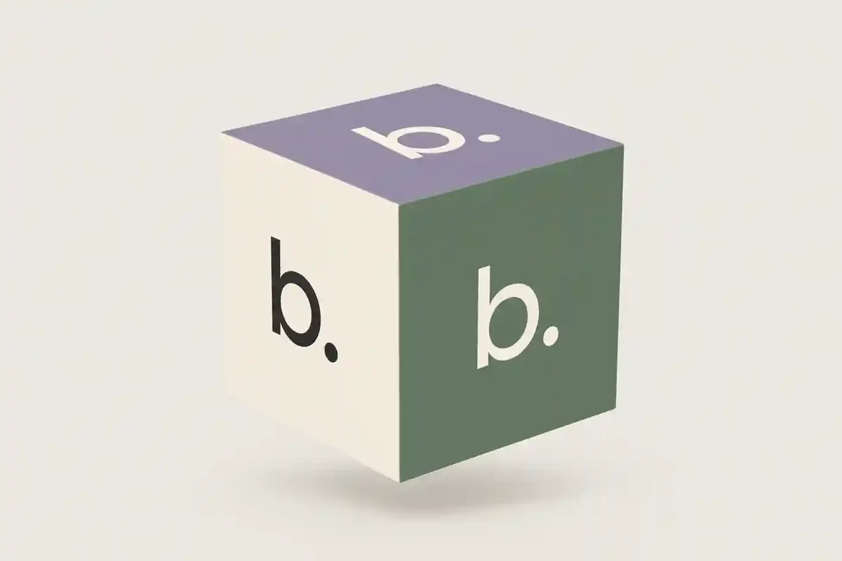The Block Orbit cube: the b. mark on cream, green and lilac faces